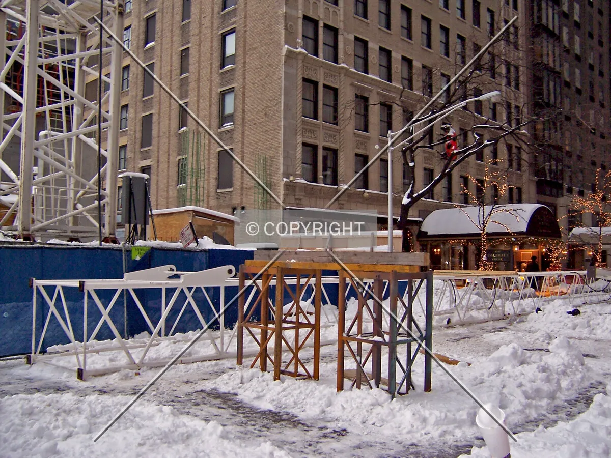Looking northeast across Delaware Street with pieces of the tower crane jib staged for assembly