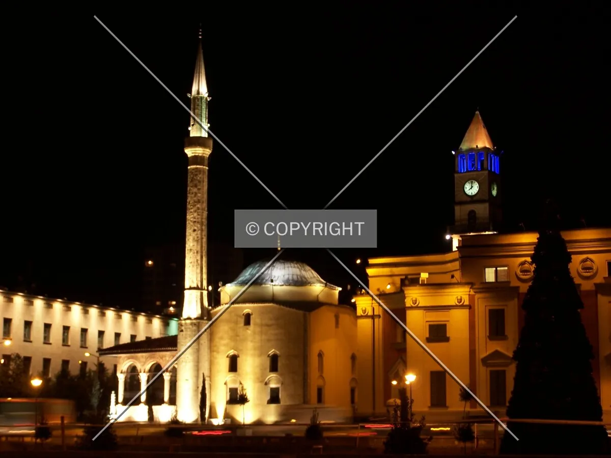 Mosque and clock tower by night