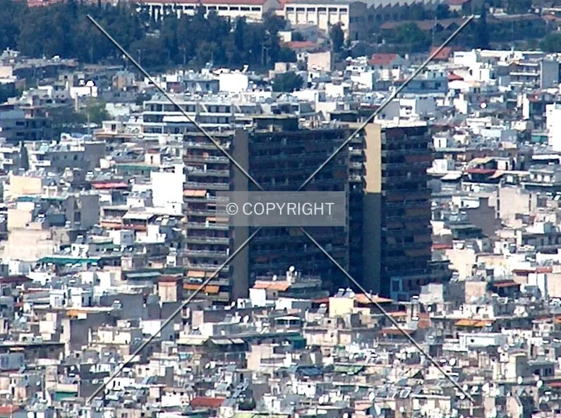 Distant view from Lycabettus Hill, depicting the complex amidst the sea of inner city residentials surrounding it