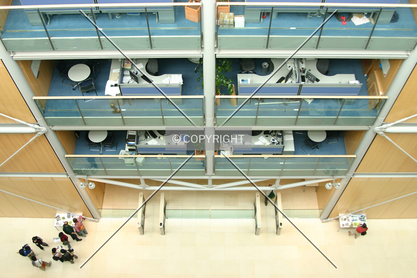 Looking down to the atrium at the entrance to the lobby and security gates
