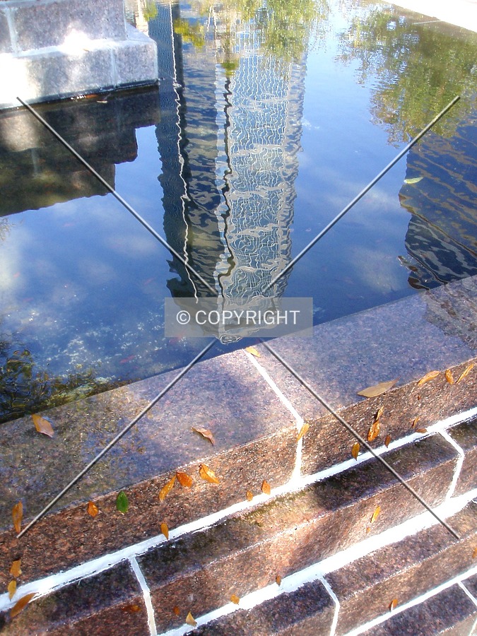 Reflecting off of a fountain near the Wachovia Bank Tower