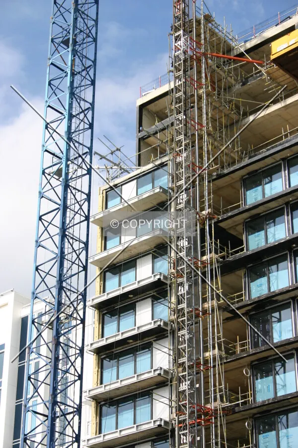 Cranes and the near-complete glazing operation