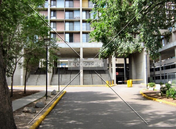 Stairs into center of complex, tower supported on stilts