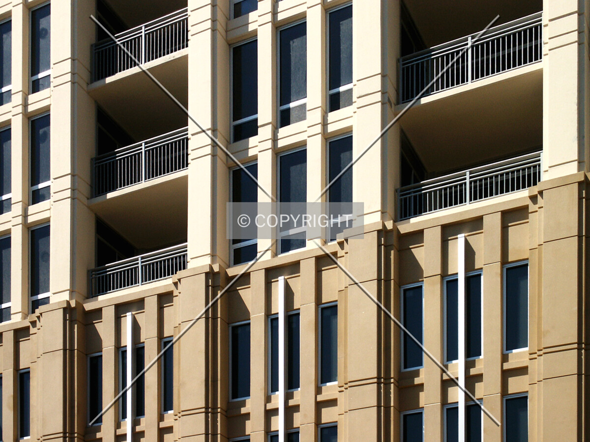 Facade detail at the garage-residential transition