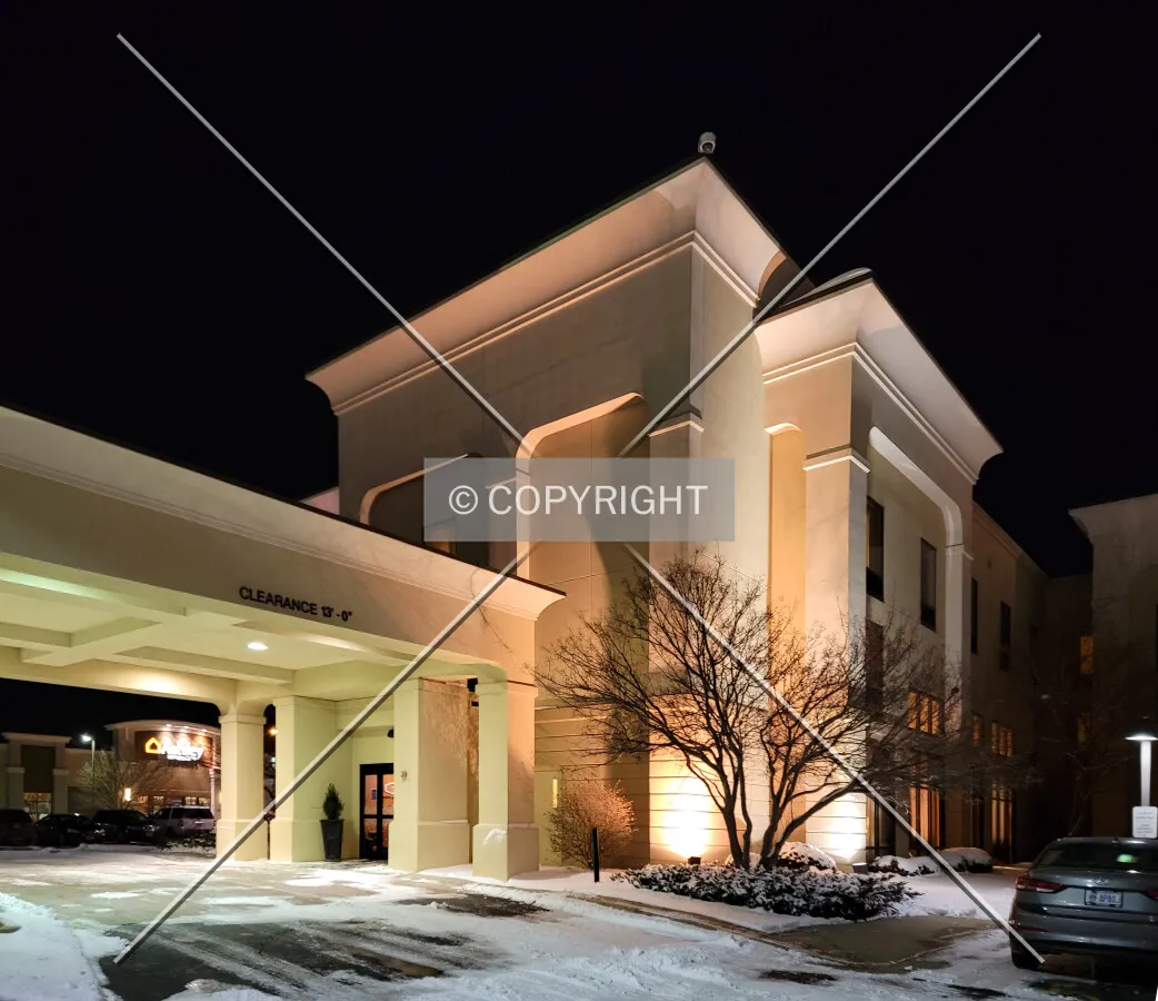 Main entrance from the southwest at night; February 16, 2021