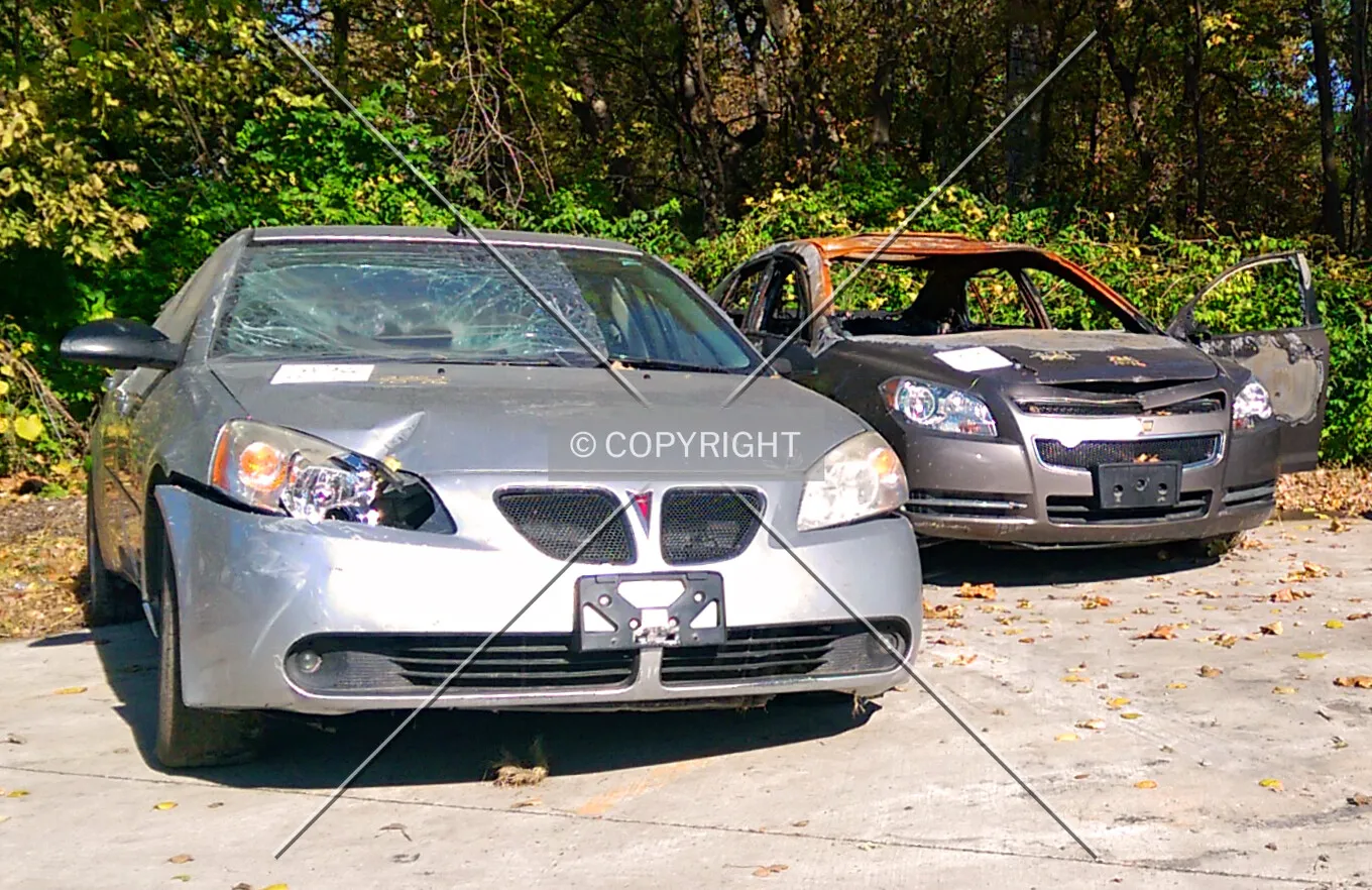 A wrecked Pontiac G6 and a burned-out Chevrolet Malibu; October 21, 2014