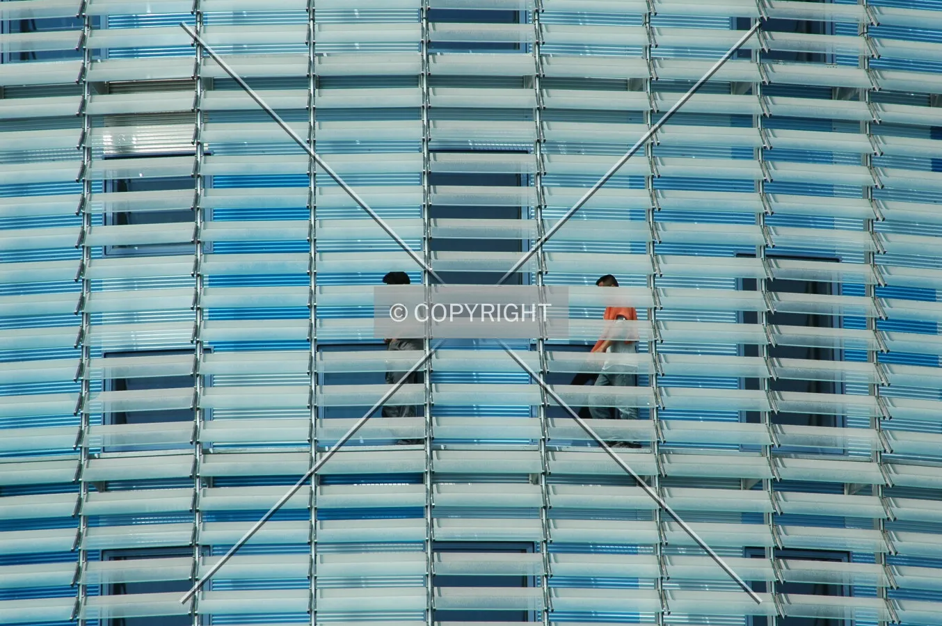 Workers doing the facade maintenance