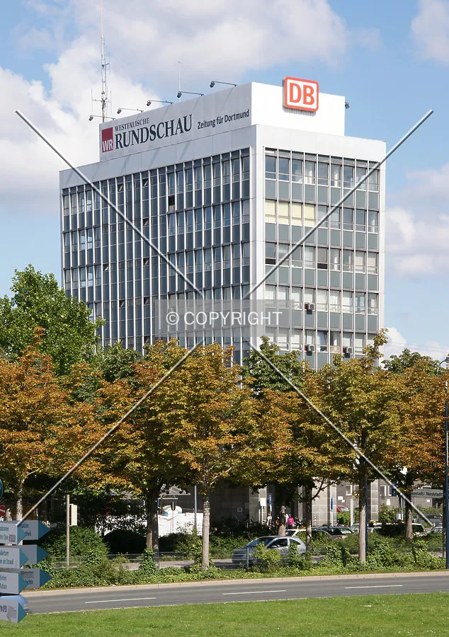 Logos of WAZ and Deutsche Bahn at the top of the building