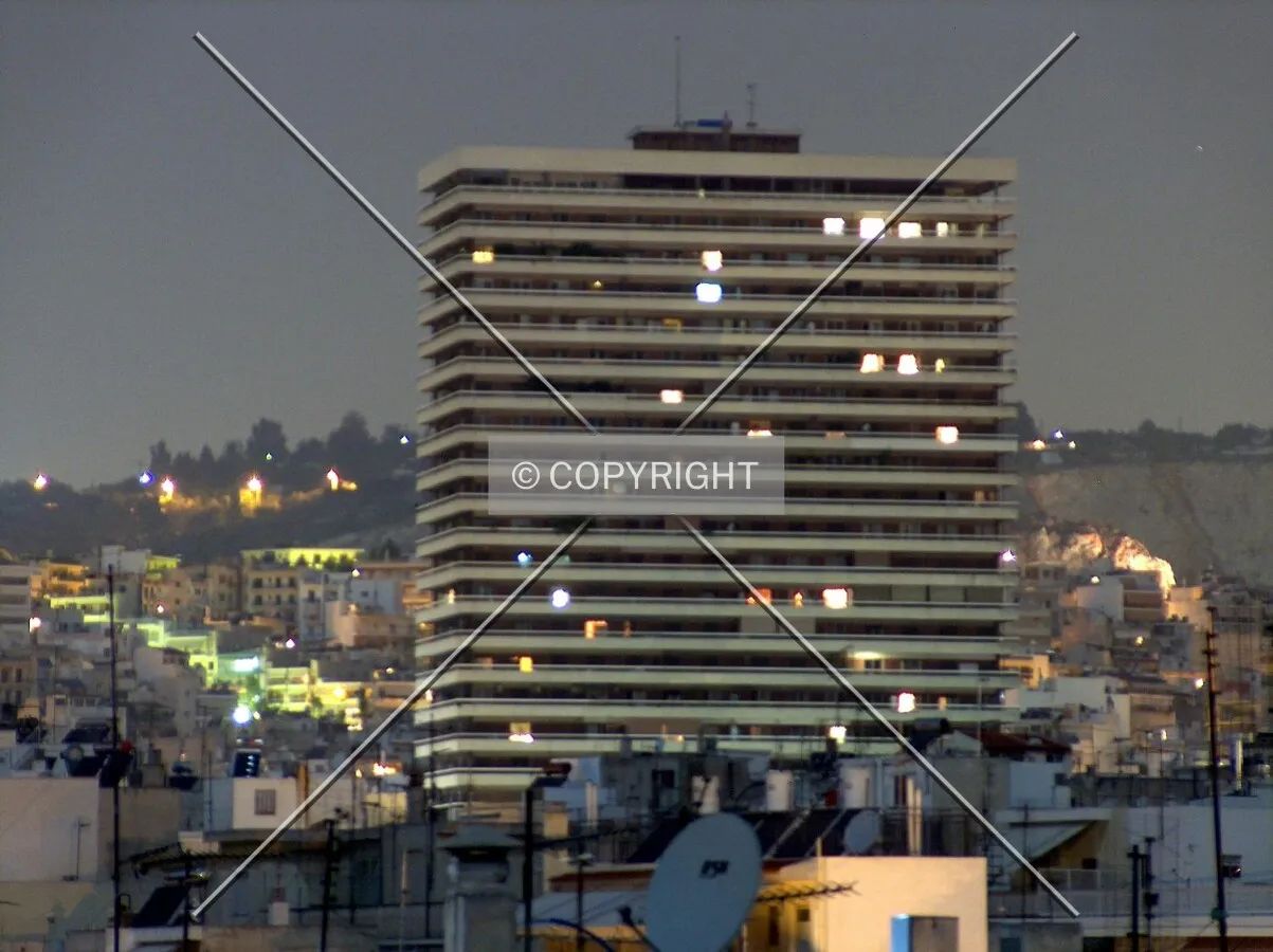 Night view of the building taken from the district of Goudi