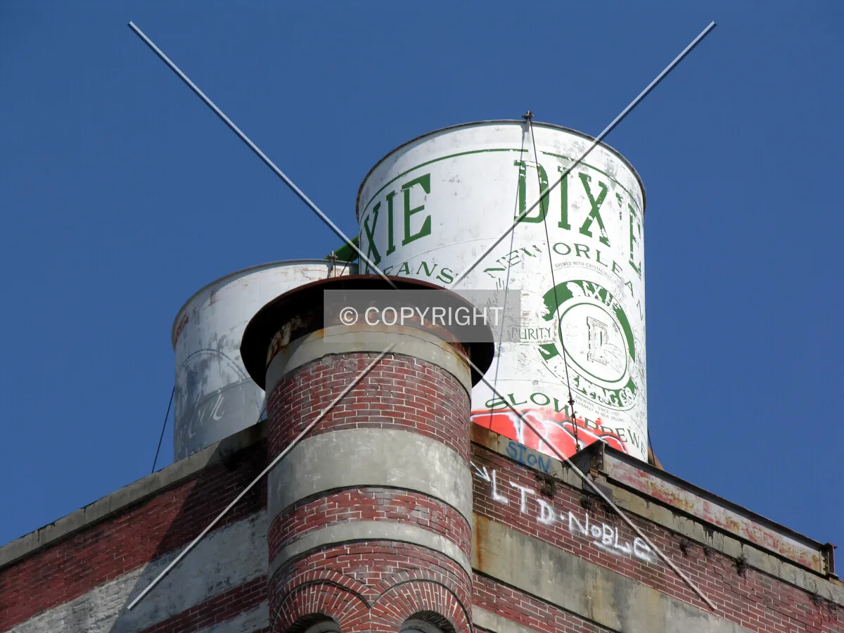 Large can of Dixie Beer atop the southwest corner
