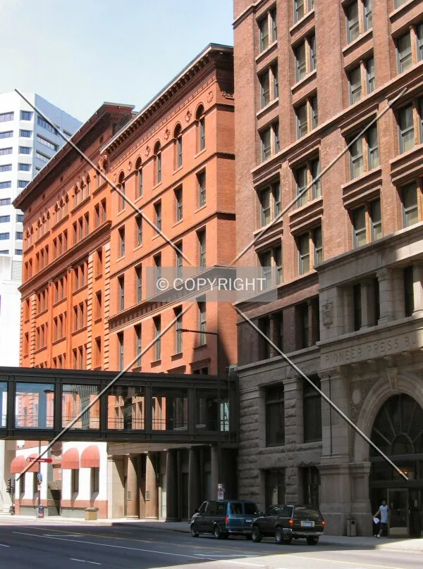 Robert Street facade, flanked by the Empire and Pioneer Buildings