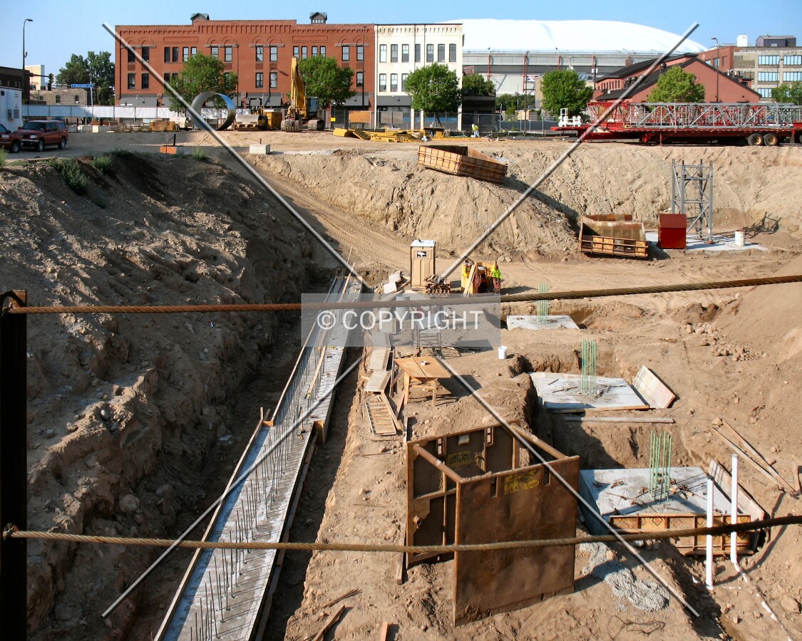 Future east foundation wall, from 2nd Street South, Metrodome in the distance