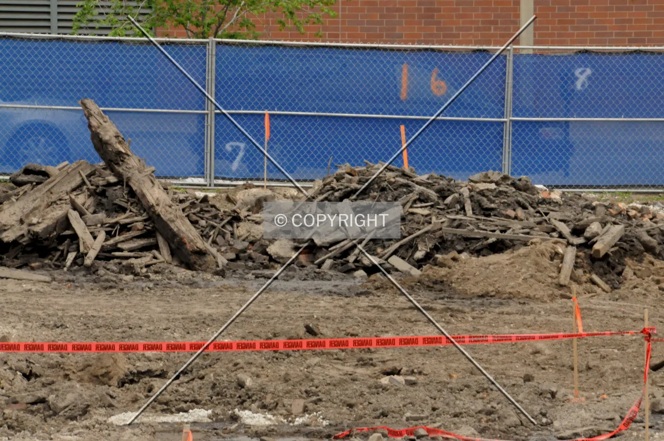 Looking east across the site from Park Drive with piles of old wooden railroad ties and timbers are seen the background