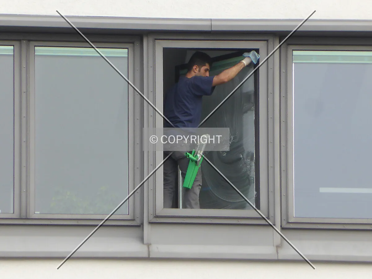 A man is cleaning windows