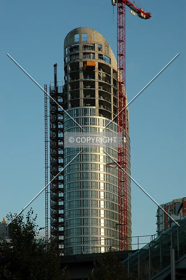 The evening sun highlights the curved facade