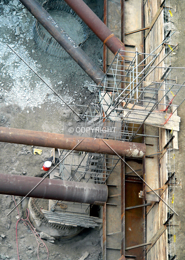 Scaffolding staircase that leads into the excavated core pit
