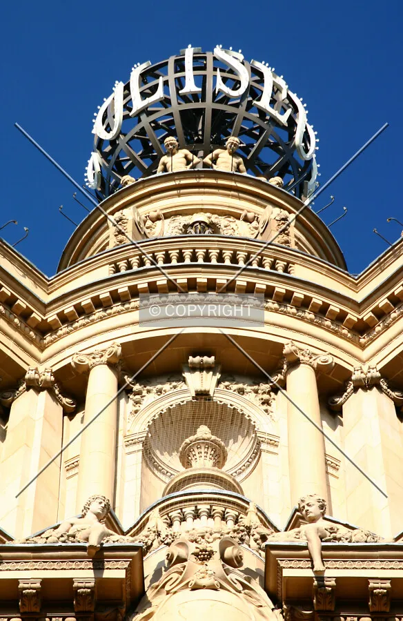 Looking up from St. Martin's Lane towards the rotating globe