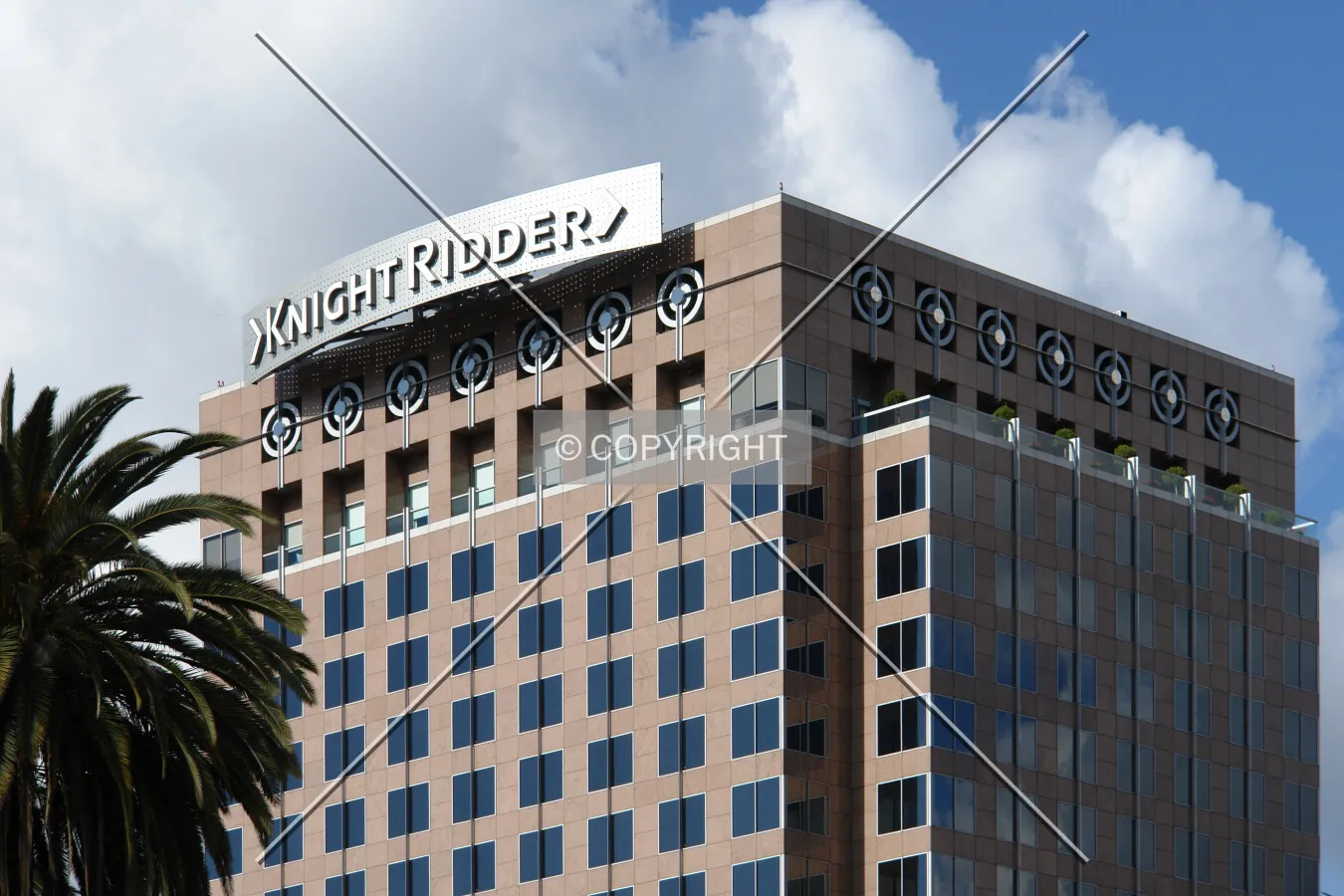 Top of the Fairmont Plaza building and Knight Ridder logo