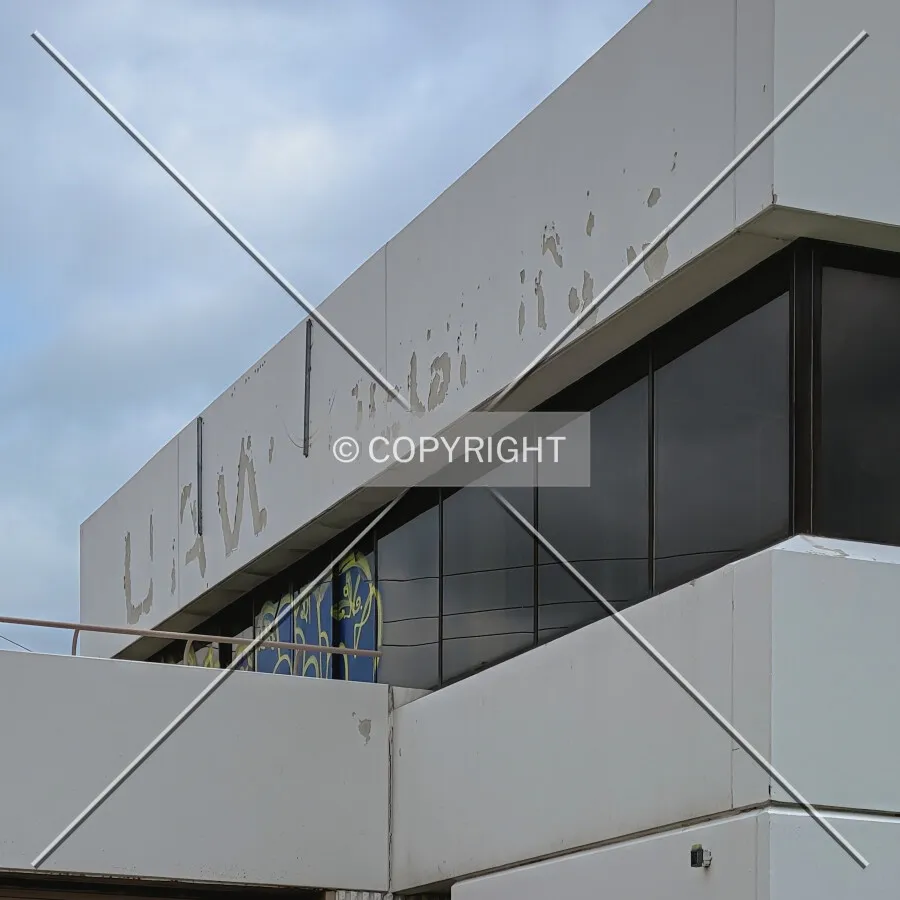 Former UAW signage location and graffiti on the west windows; June 26, 2021