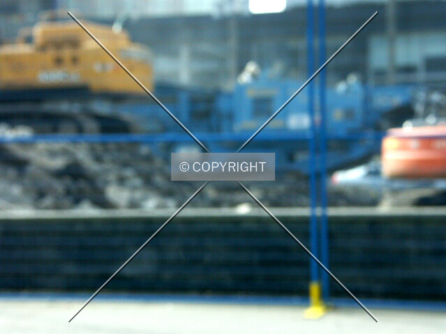 Abstract view from Georgia of heavy equipment demolishing buildings