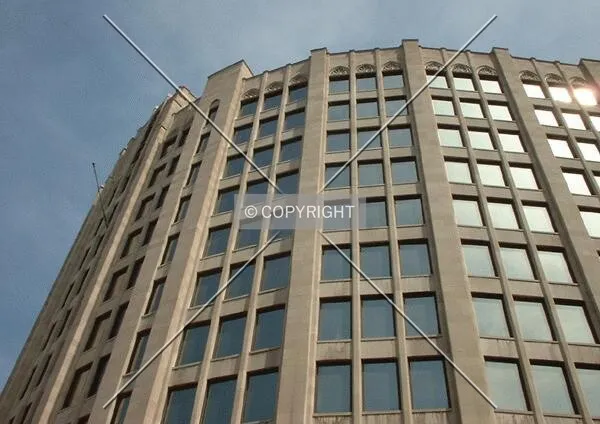 Looking up at curved facade, from Locust Street