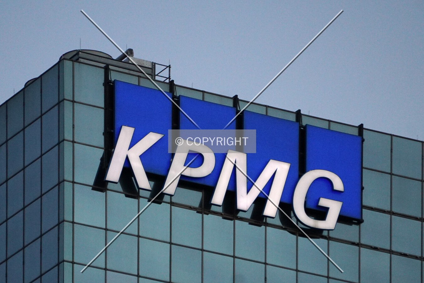 Evening view of the KPMG logo on the northwest corner; June 12, 2017