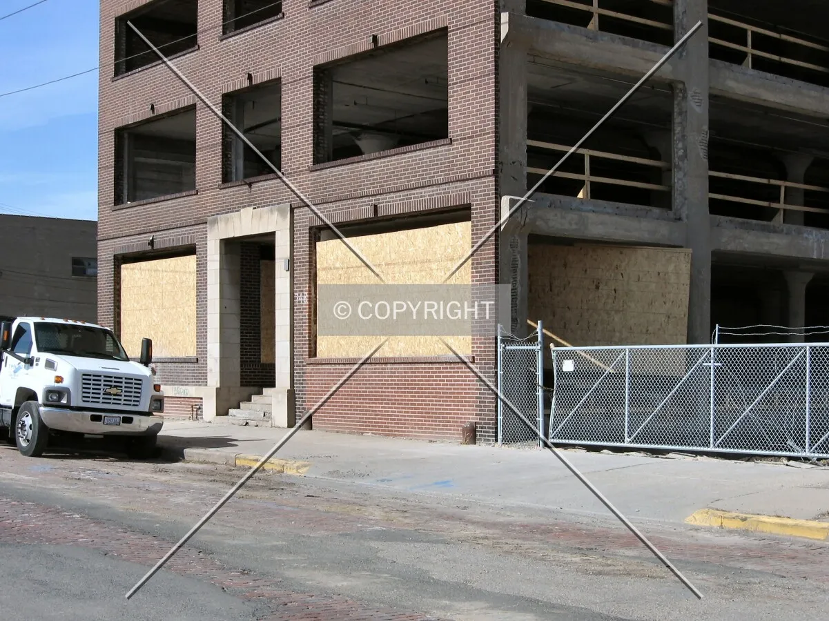 Covering first-floor window openings with particleboard