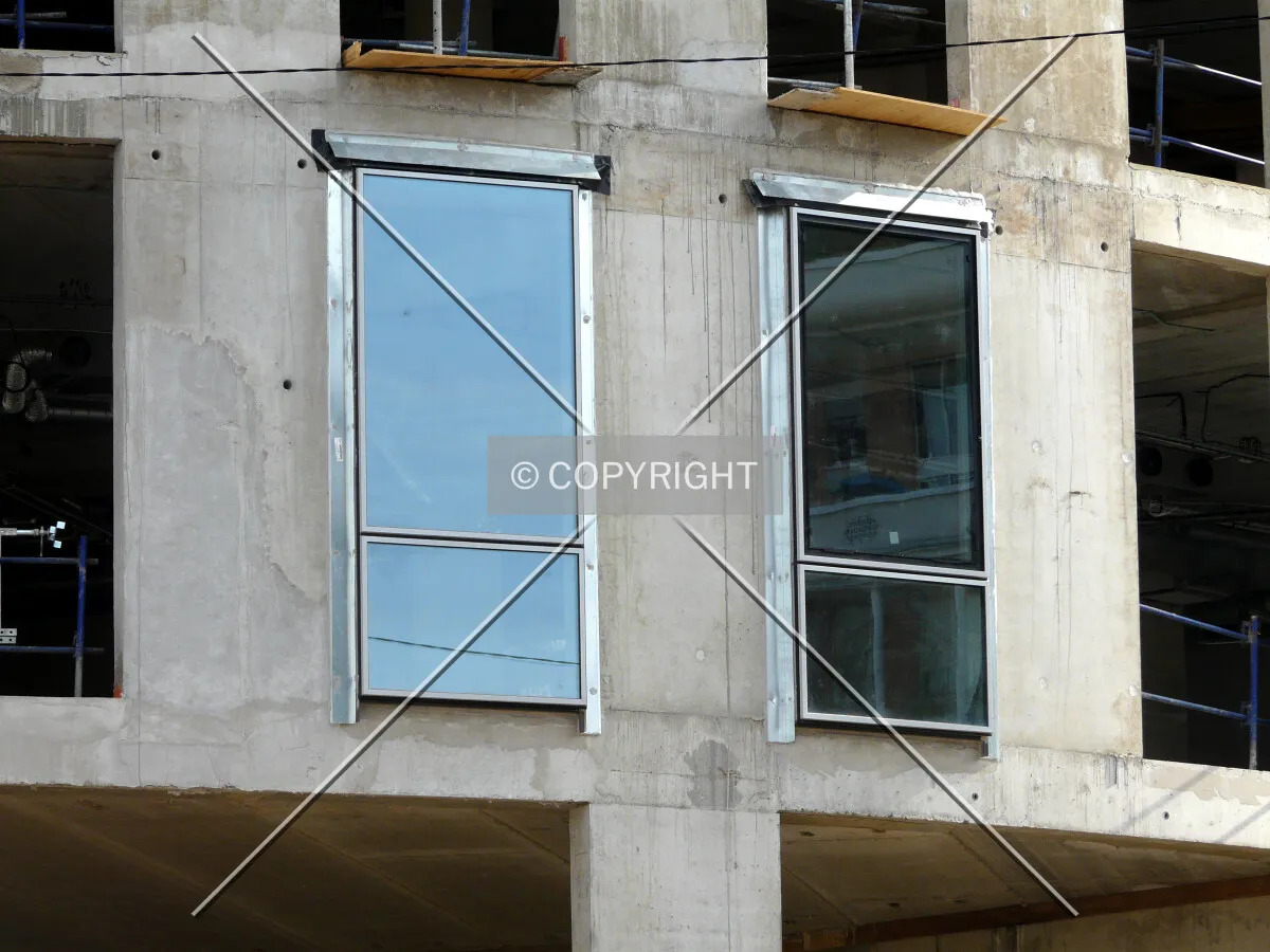 First two windows installed on second floor on the north curved corner