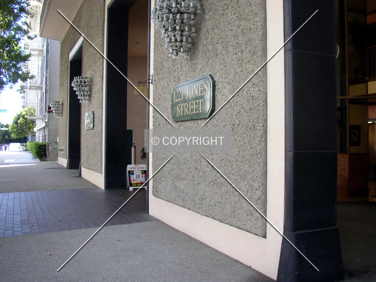 Signage at the building’s base along Jones Street