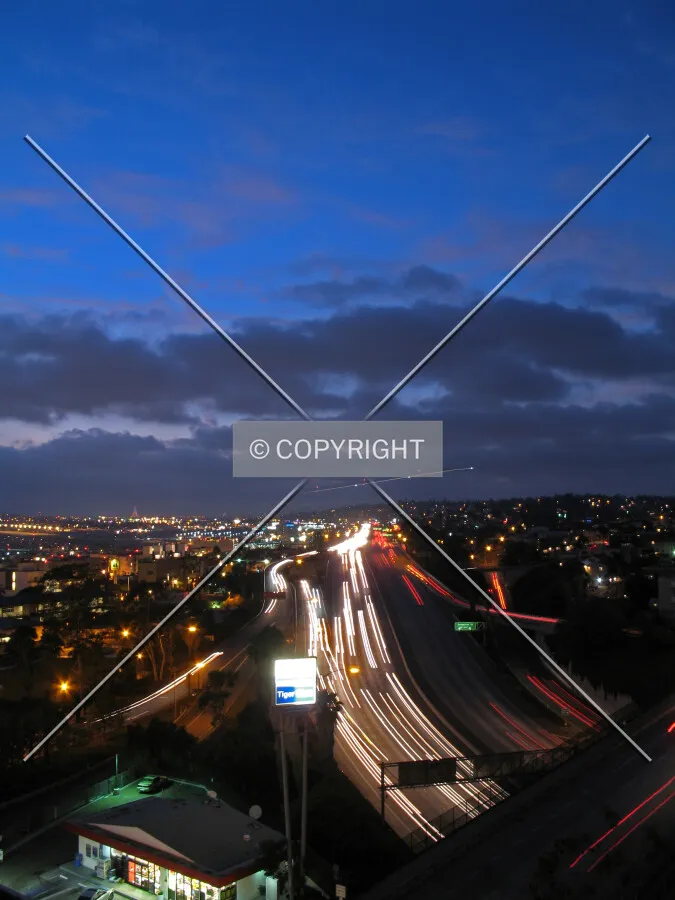 Looking northwest, as a plane makes its approach over Highway 5