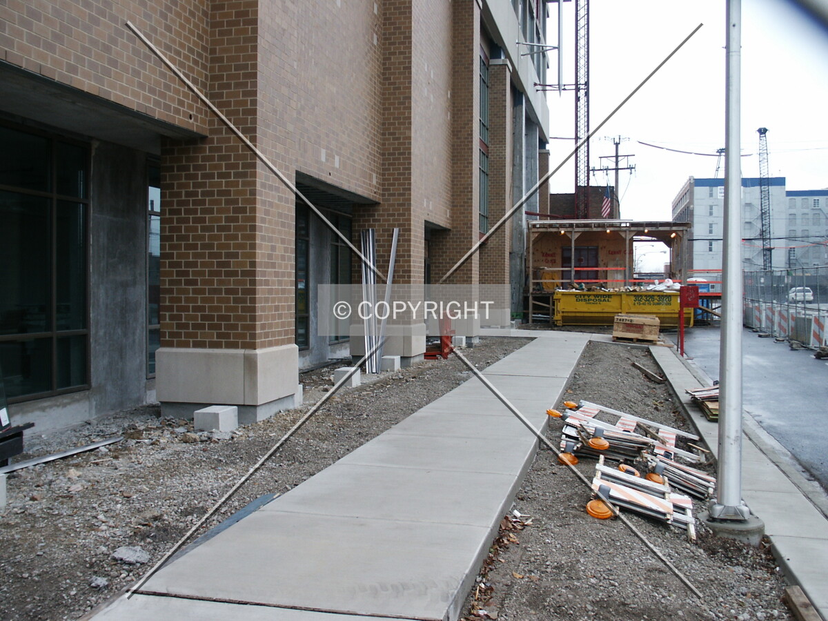Sidewalk and base along the north side; 27 November 2003