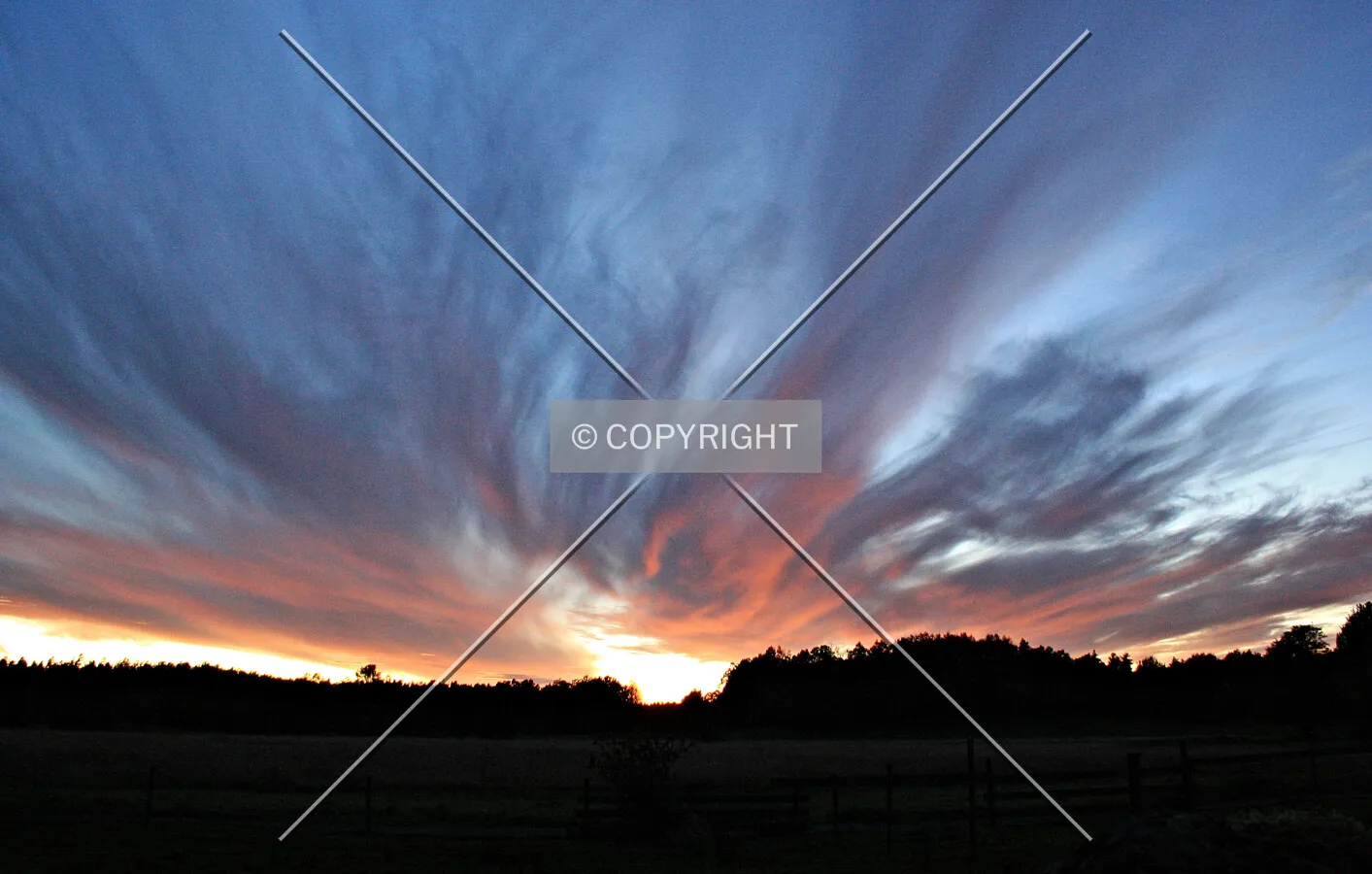 Sunset and a forest in shadows