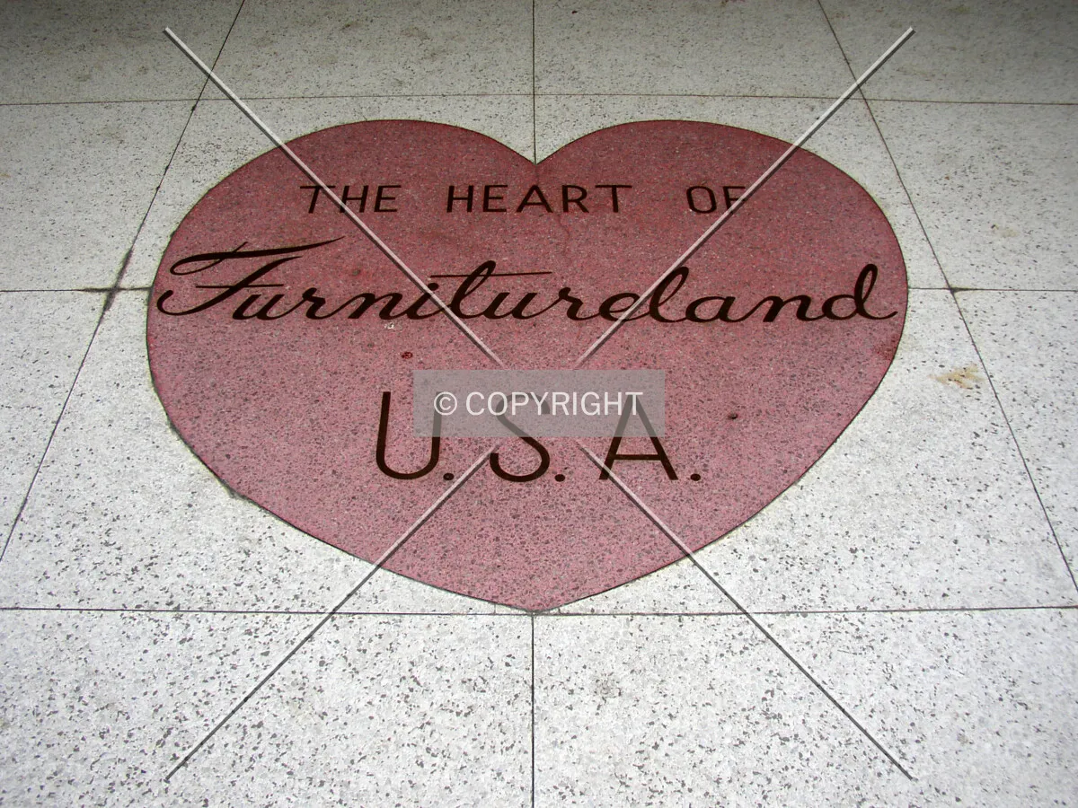Signage on the sidewalk at the Main Street entrance