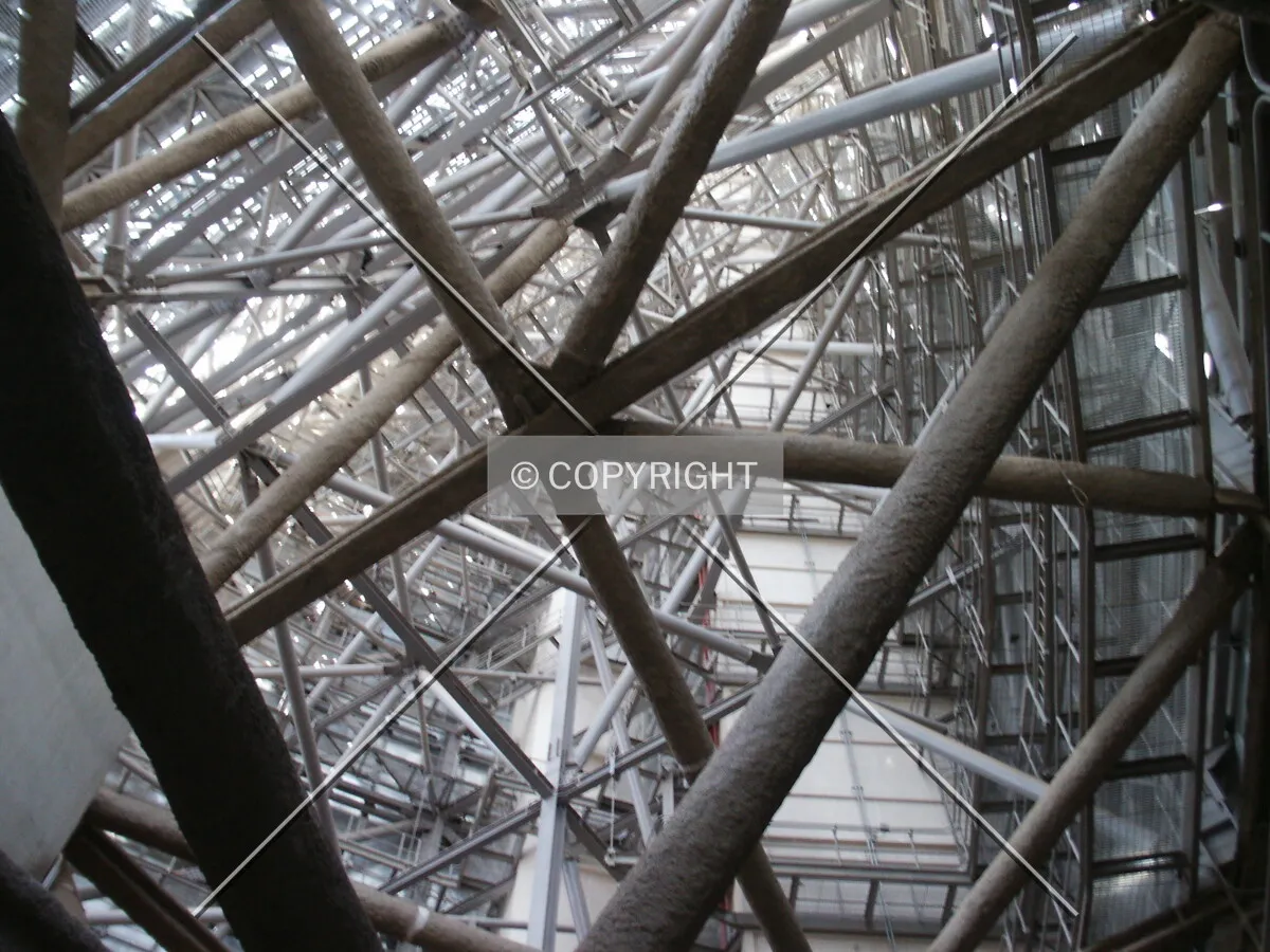 Looking up towards the roof inside one of the spaces to the side of the hole