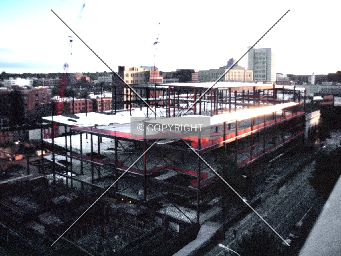 View from the northeast showing foundation work of One City Place and steel framing of the adjacent retail space