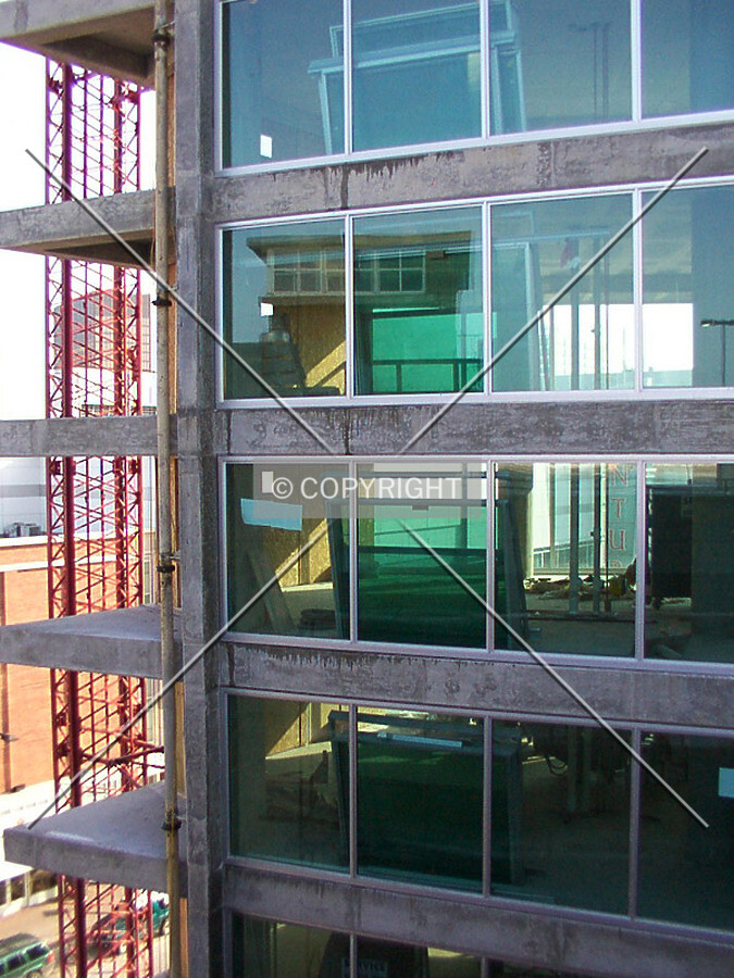 Northeast corner with hoist and green glass panels
