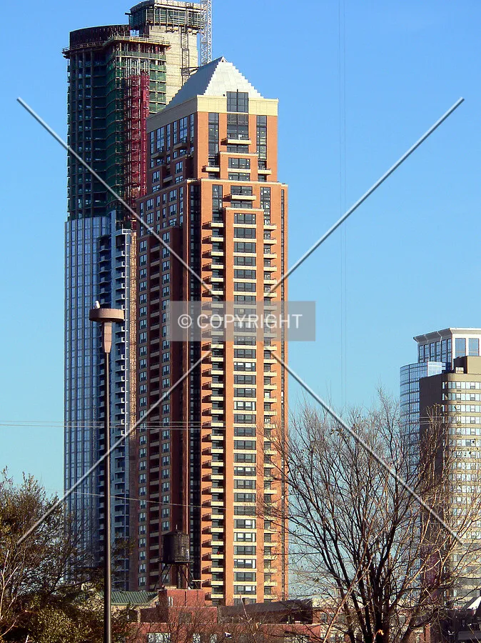 View to the southwest from the Chicago River with One Museum Park under construction in the background