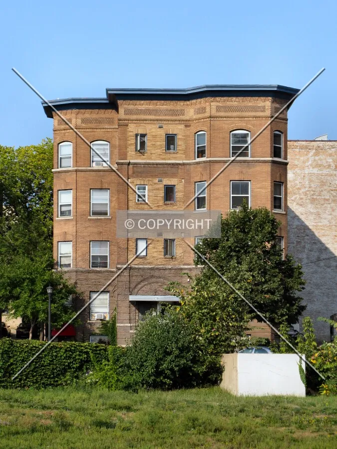 View to the west across Lyndale Avenue/Hennepin Avenue; ground floor partially hidden