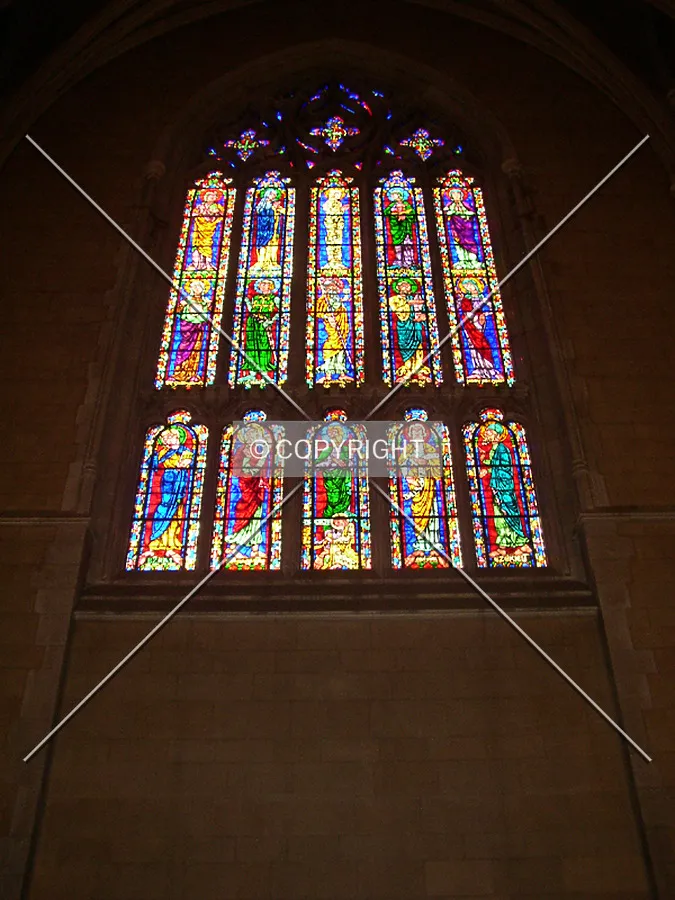 Stained glass window on the south transept containing figures from both the New and Old Testaments