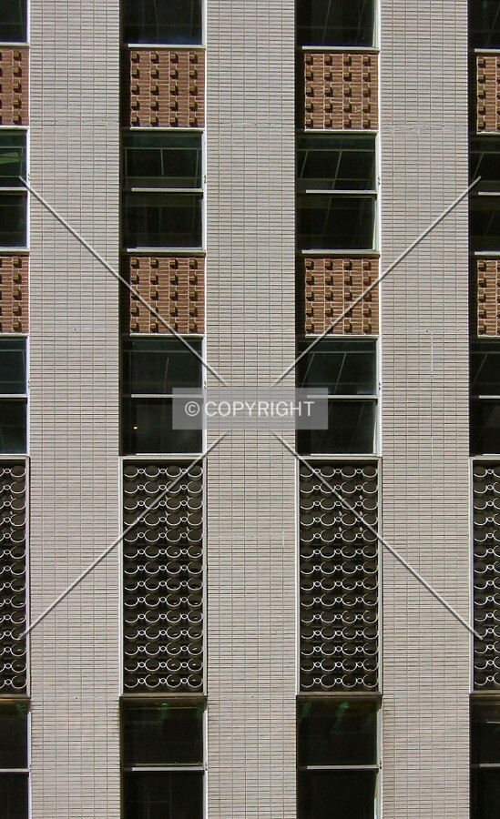 Fenestration and facade detail along Baronne Street