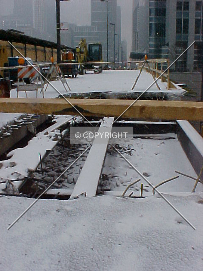 A portion of missing sidewalk on upper Randolph in front of the construction site