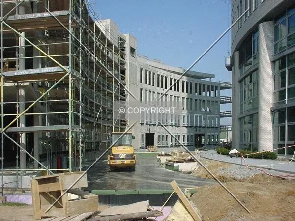 Between the tower (right) and the low-rise wing (left)