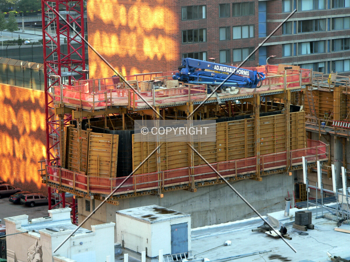 Core beginning to rise above neighboring buildings
