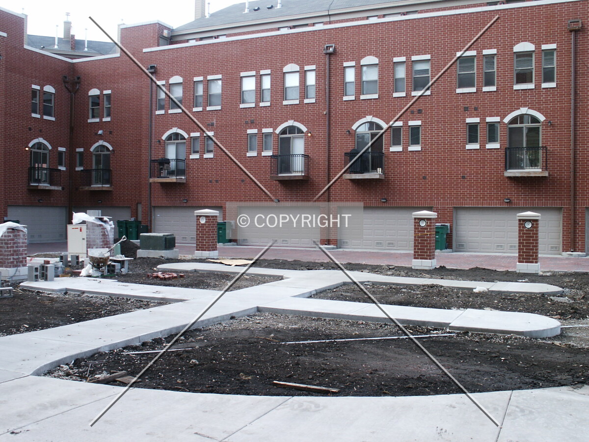 Front yard bounded by rowhouses