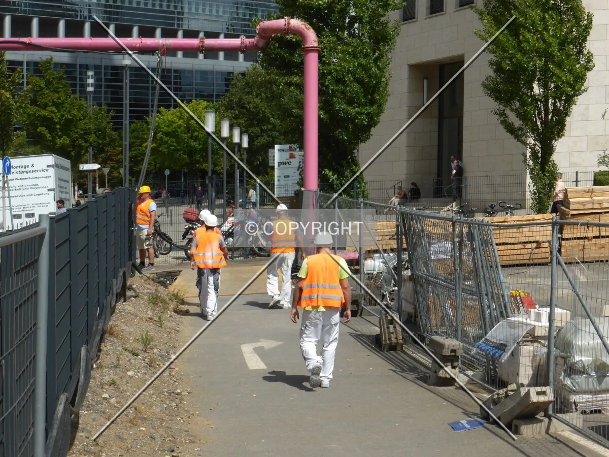 Construction workers walking on the street in Frankfurt, Germany