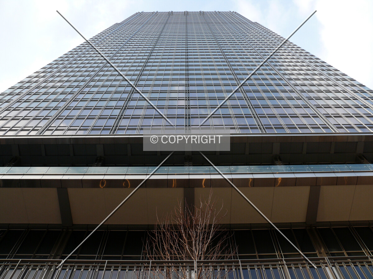 View up the southern facade as seen from the riverside plaza