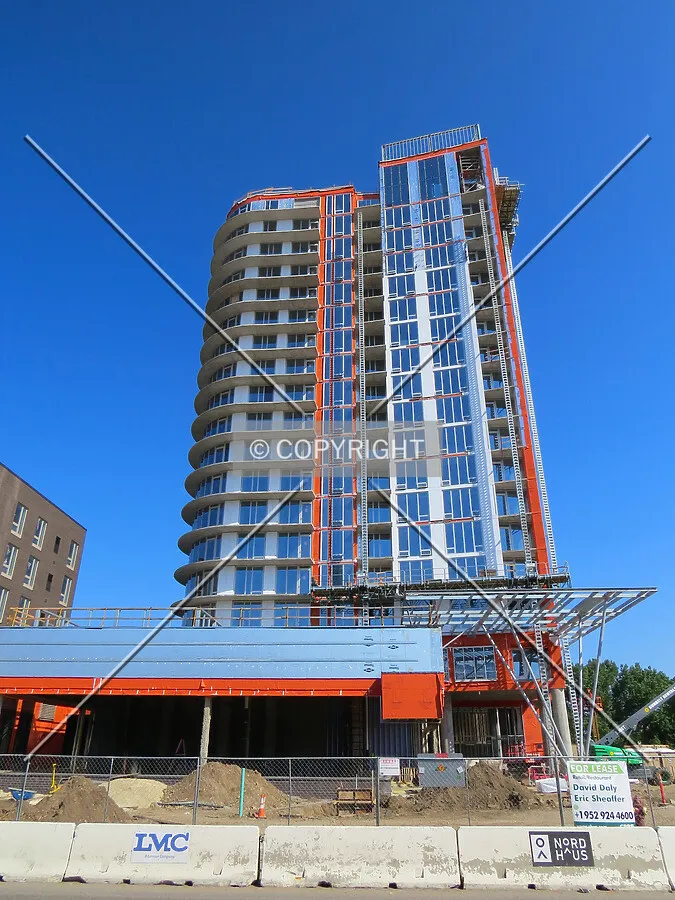 Looking up from across 1st Avenue NE
