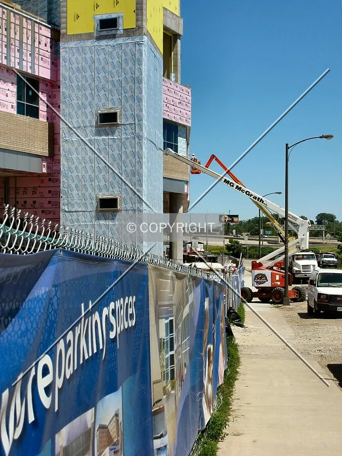 Facade installation along East 12th Street