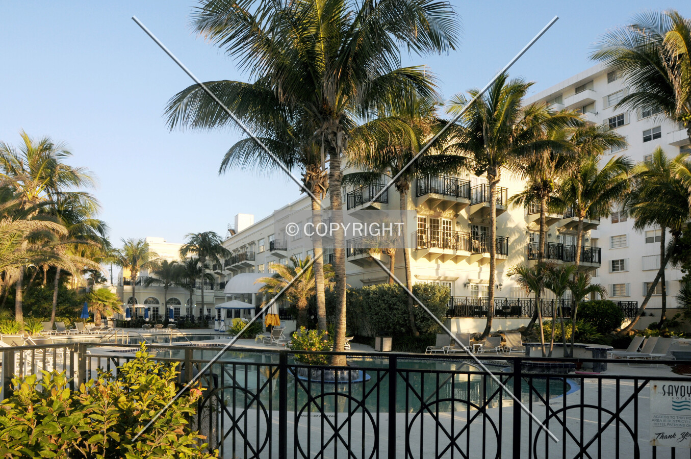 View of the pool area from the beach at dawn