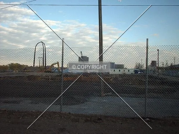 Twilight view of the excavation, looking east across the construction site